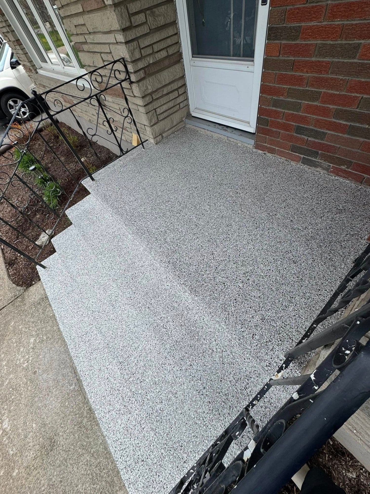Grey flake epoxy front steps and landing from above