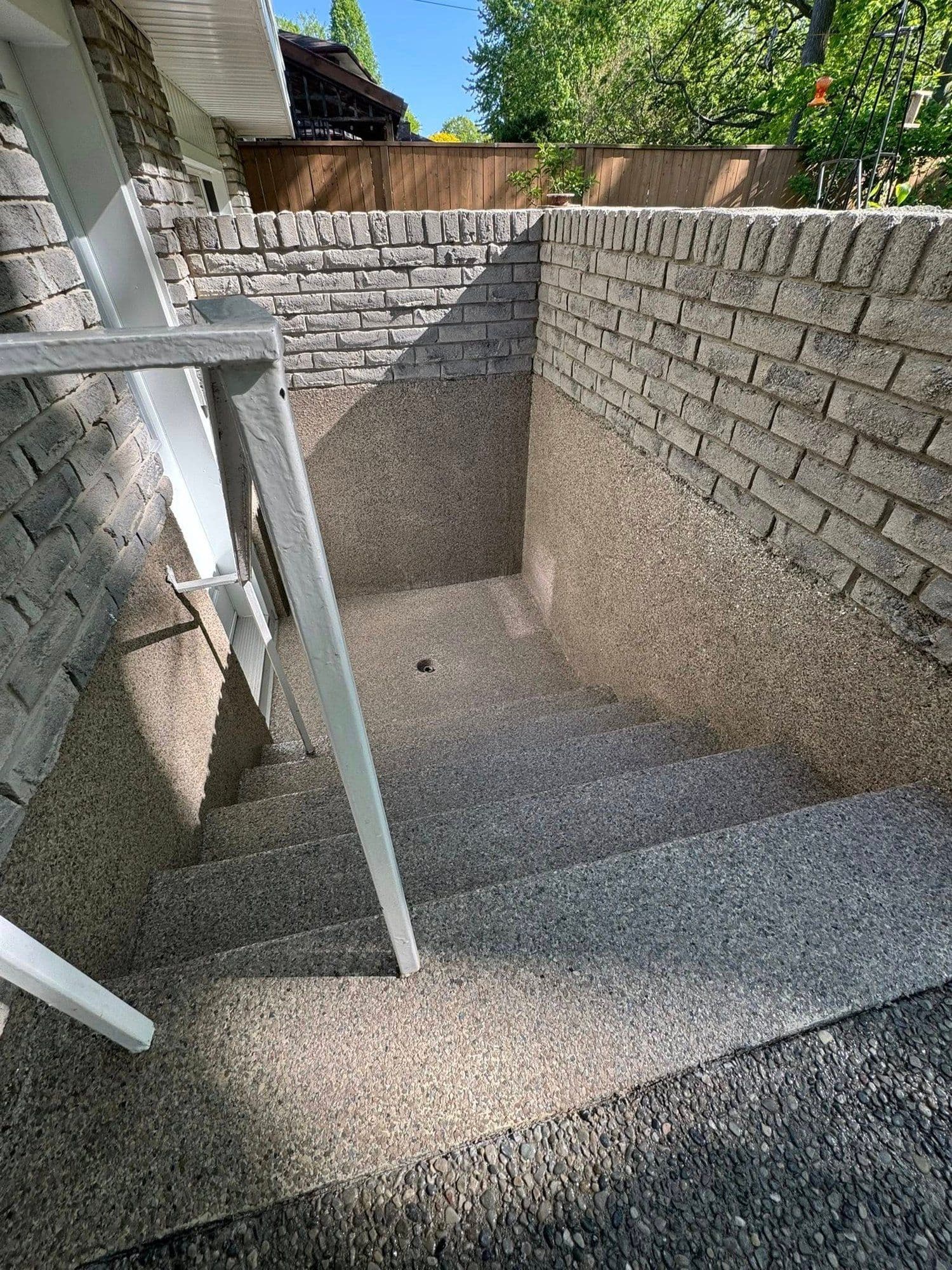 Grey flake epoxy walkout steps from the top landing